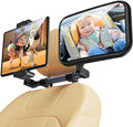 2-in-1 baby car mirror with tablet holder mounted on car headrest, showing rear-facing infant seat view
